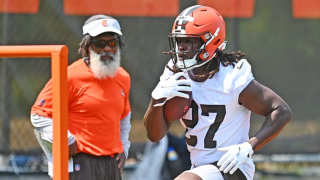 Jul 28, 2021; Berea, Ohio, USA; Cleveland Browns running back Kareem Hunt (27) runs a drill as running backs coach Stump Mitchell looks on during training camp at CrossCountry Mortgage Campus. Mandatory Credit: Ken Blaze-USA TODAY Sports