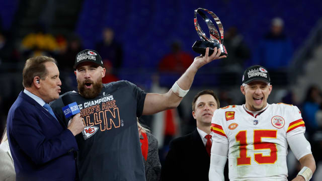 Jan 28, 2024; Baltimore, Maryland, USA; Kansas City Chiefs tight end Travis Kelce (M) celebrates with the Lamar Hunt Trophy while speaking with CBS broadcaster Jim Nance during the trophy presentation after the Chiefs' game against the Baltimore Ravens in the AFC Championship football game at M&T Bank Stadium. Mandatory Credit: Geoff Burke-USA TODAY Sports  