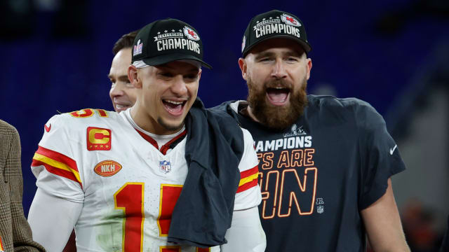 Jan 28, 2024; Baltimore, Maryland, USA; Kansas City Chiefs quarterback Patrick Mahomes (15) and Chiefs tight end Travis Kelce (R) celebrate on the stage prior to the trophy presentation after their' game against the Baltimore Ravens in the AFC Championship football game at M&T Bank Stadium. Mandatory Credit: Geoff Burke-USA TODAY Sports  