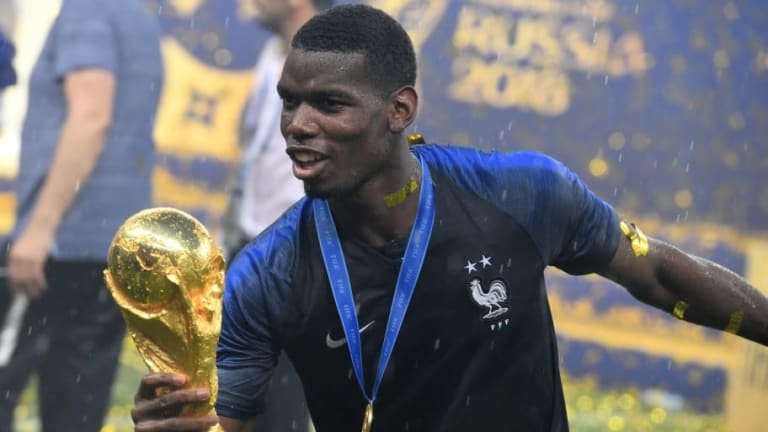 PHOTO: Man Utd Star Paul Pogba Dabs With World Cup Trophy as He Silences His Critics