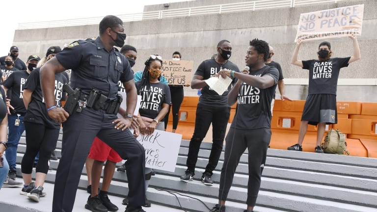 Former Virginia Tech Wide Receiver Ernest Wilford Making a Difference as Police Officer in Jacksonville