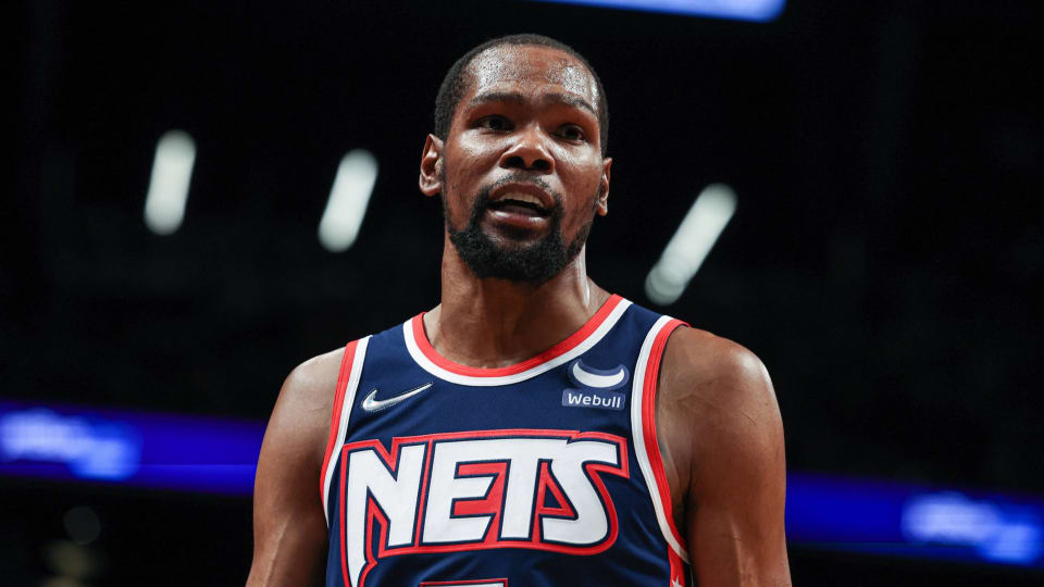 Nets forward Kevin Durant in a game with a retro Nets jersey on.