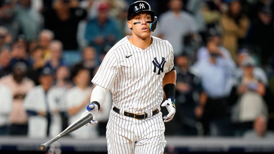New York Yankees’ Aaron Judge tosses his bat after being walked during the first inning of a baseball game against the Boston Red Sox Thursday, Sept. 22, 2022, in New York.