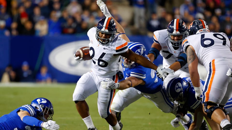 Oct 30, 2021; Provo, Utah, USA; Virginia Cavaliers running back Devin Darrington (26) runs against the Brigham Young Cougars in the third quarter at LaVell Edwards Stadium. Mandatory Credit: Jeffrey Swinger-USA TODAY Sports  
