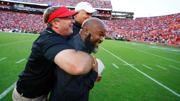 Sep 30, 2023; Auburn, Alabama, USA; Georgia Bulldogs head coach Kirby Smart celebrates with his coaches following the Bulldogs 27-20 victory at Jordan-Hare Stadium.