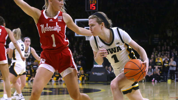 Iowa's Molly Davis drives to the basket as Nebraska's Jaz Shelley defends Saturday, Jan. 27, 2024 at Carver-Hawkeye Arena in Iowa City, Iowa.