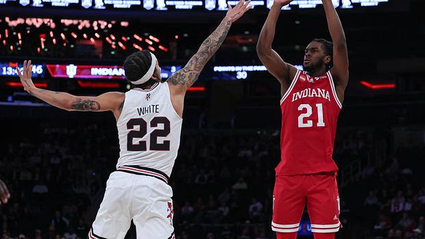 Indiana Hoosiers forward Mackenzie Mgbako (21) shoots the ball as Louisville Cardinals guard Tre White (22) defends during the second half at Madison Square Garden.