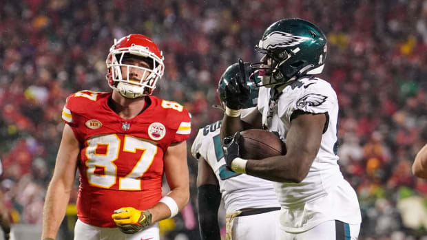Philadelphia Eagles linebacker Nicholas Morrow (41) celebrates after recovering a fumble as Kansas City Chiefs tight end Travis Kelce (87) reacts during the second half at GEHA Field at Arrowhead Stadium.