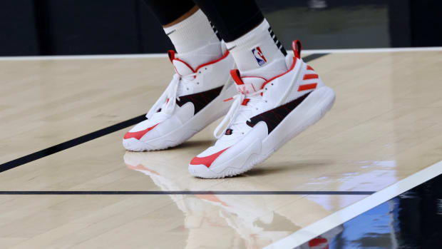Damian Lillard's white, black, and red Adidas shoes.