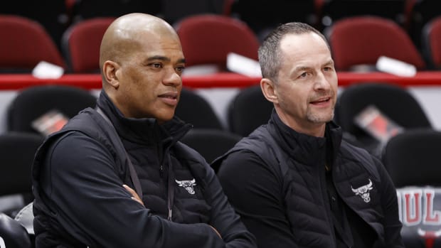 Chicago Bulls executive vice president of basketball operations Arturas Karnisovas (right) talks with general manager Marc Eversley (left) before game three of the first round for the 2022 NBA playoffs