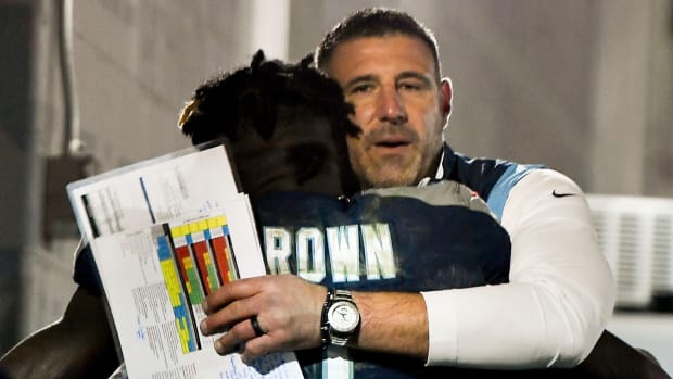 Tennessee Titans head coach Mike Vrabel hugs wide receiver A.J. Brown (11) after they beat the 49ers at Nissan Stadium Thursday, Dec. 23, 2021 in Nashville, Tenn.