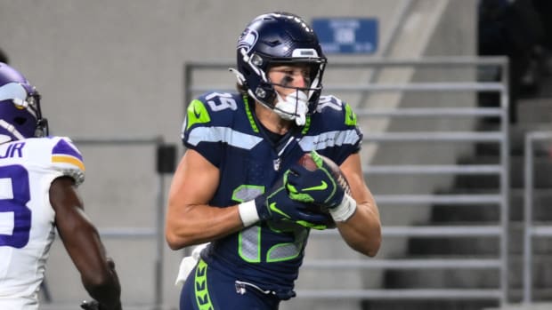 Seattle Seahawks wide receiver Jake Bobo (19) runs the ball in for a touchdown past Minnesota Vikings cornerback Andrew Booth Jr. (23) during the second half at Lumen Field.
