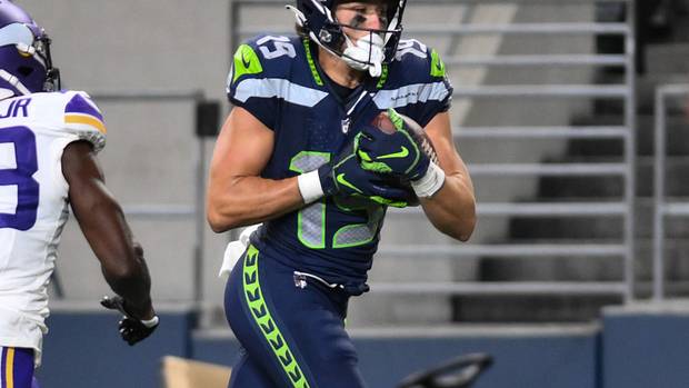 Seattle Seahawks wide receiver Jake Bobo (19) runs the ball in for a touchdown past Minnesota Vikings cornerback Andrew Booth Jr. (23) during the second half at Lumen Field.