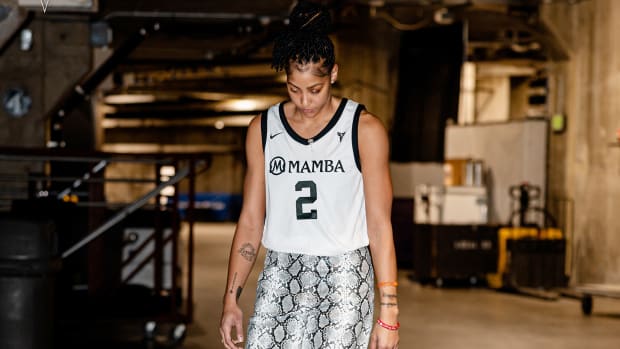 Candace Parker walks into an arena before a game.