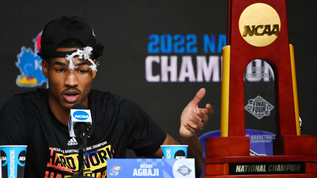 Kansas Jayhawks guard Ochai Agbaji (30) speaks during a press conference after defeating the North Carolina Tar Heels in the 2022 NCAA men's basketball tournament Final Four championship game at Caesars Superdome.