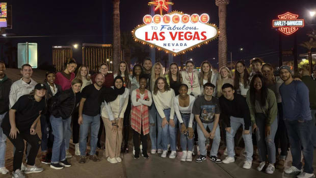 The Indiana women's basketball program stands in front of the Las Vegas sign.