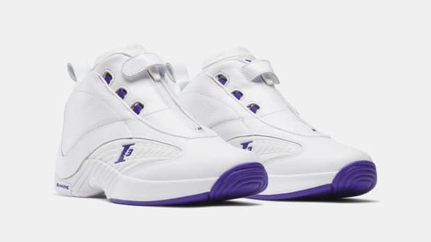 Side view of Allen Iverson's white and purple Reebok shoes.