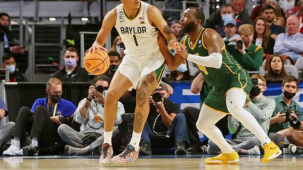 Baylor Bears forward Jeremy Sochan (1) dribbles the ball against Norfolk State Spartans guard Joe Bryant Jr. (4) during the second half during the first round of the 2022 NCAA Tournament at Dickies Arena.