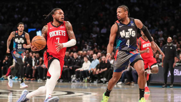 Rockets forward Cam Whitmore (7) looks to drive past Brooklyn Nets guard Dennis Smith Jr. (4) in the fourth quarter at Barclays Center.