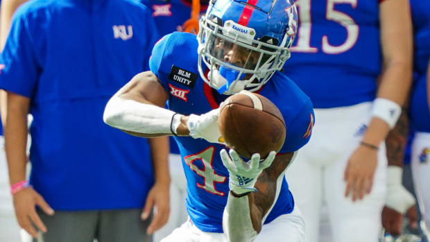 Oct 3, 2020; Lawrence, Kansas, USA; Kansas Jayhawks wide receiver Andrew Parchment (4) catches a pass against the Oklahoma State Cowboys during the first half at David Booth Kansas Memorial Stadium. Mandatory Credit: Jay Biggerstaff-USA TODAY Sports