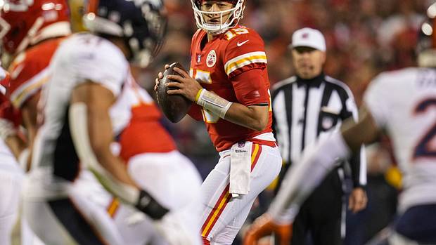 Kansas City Chiefs quarterback Patrick Mahomes (15) drops back to pass against the Denver Broncos during the first half at GEHA Field at Arrowhead Stadium.