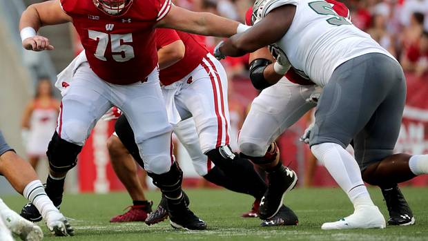 Wisconsin offensive lineman Joe Tippmann blocking against Eastern Michigan in 2021.