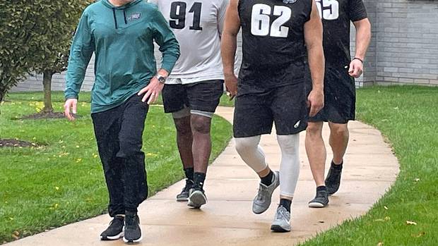 Howie Roseman with Fletcher Cox (91), Jason Kelce (62), and Lane Johnson following a walkthrough practice on Oct. 26, 2022