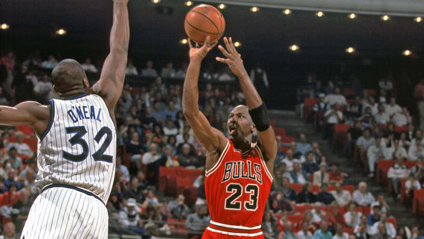 Chicago Bulls guard (23) Michael Jordan shoots over Orlando Magic center (32) Shaquille O' Neal
