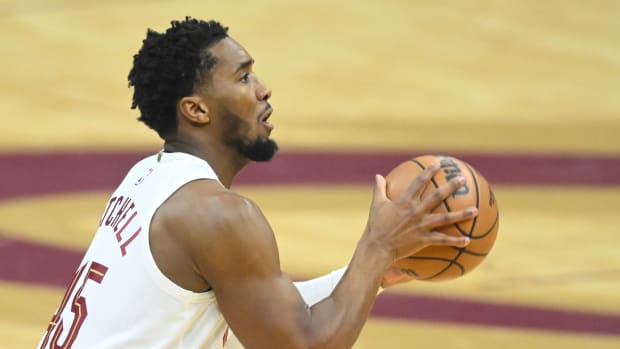 Dec 18, 2023; Cleveland, Ohio, USA; Cleveland Cavaliers guard Donovan Mitchell (45) shoots in the first quarter against the Houston Rockets at Rocket Mortgage FieldHouse.