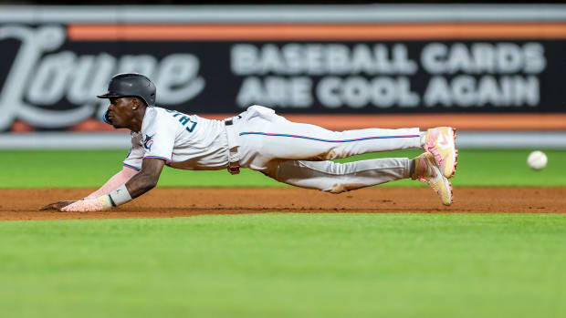 Miami Marlins center fielder Jazz Chisholm Jr. slides into second base.