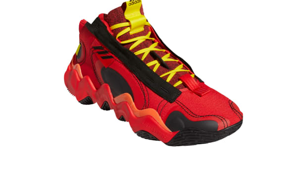 Red, black, and yellow Adidas shoes.