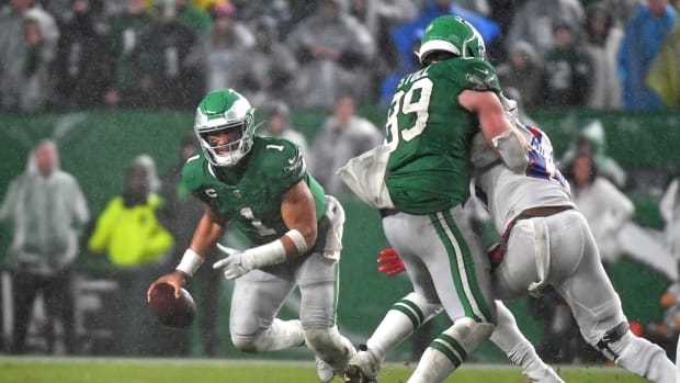 Philadelphia Eagles quarterback Jalen Hurts (1) scrambles away from pressure against the Buffalo Bills during overtime at Lincoln Financial Field.