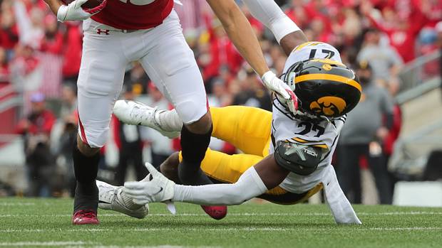 Wisconsin wide receiver Chimere Dike breaks a tackle against Iowa.