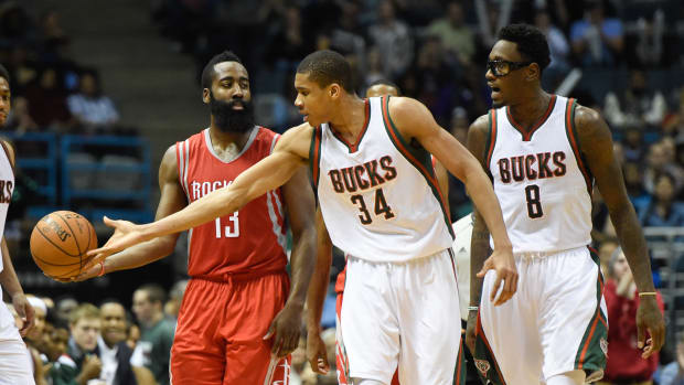 Milwaukee Bucks guard Giannis Antetokounmpo (34) knocks the ball away form Houston Rockets guard James Harden (13)