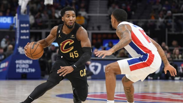 Nov 27, 2022; Detroit, Michigan, USA; Cleveland Cavaliers guard Donovan Mitchell (45) dribbles against Detroit Pistons guard Rodney McGruder (17) in the first quarter at Little Caesars Arena. Mandatory Credit: Lon Horwedel-USA TODAY