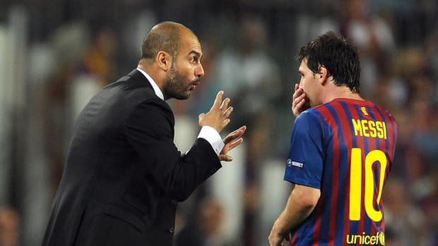 Pep Guardiola pictured (left) giving instructions to Lionel Messi during a Barcelona match in 2011