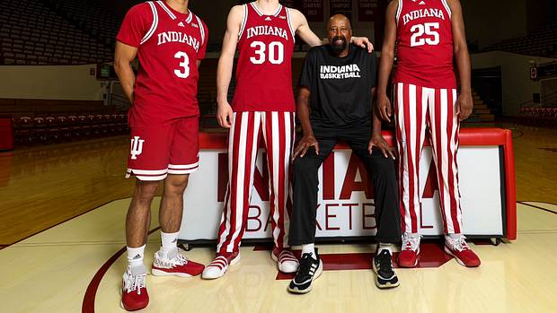 Montverde Academy teammates Curtis Givens III (3), Liam McNeeley (30), Derik Queen (25) and Indiana coach Mike Woodson pictured together at Simon Skjodt Assembly Hall in Bloomington, Ind.
