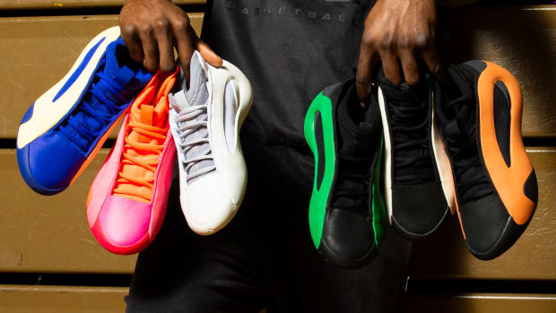 James Harden holds six pairs of his multicolor adidas basketball shoes.