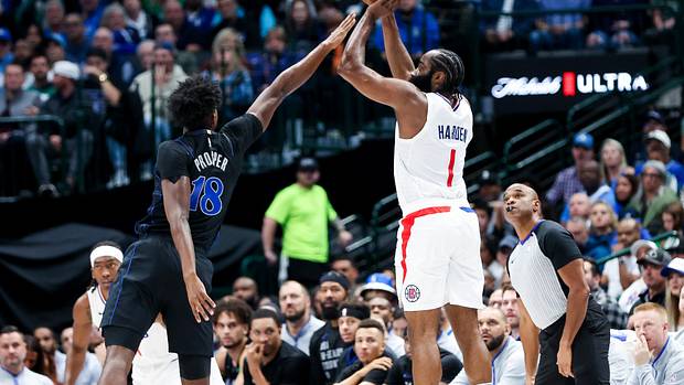 Dallas Mavericks rookie Olivier-Maxence Prosper attempts to block Los Angeles Clippers star James Harden.