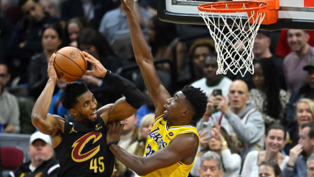 Cleveland Cavaliers guard Donovan Mitchell (45) drives against Los Angeles Lakers center Thomas Bryant (31) in the third quarter at Rocket Mortgage FieldHouse.