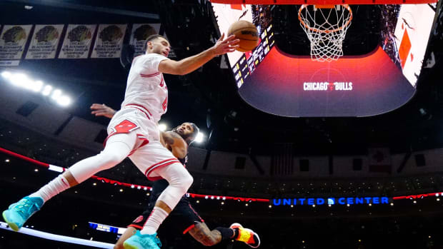 Chicago Bulls shooting guard Zach LaVine flies through the air against the Toronto Raptors