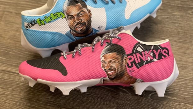 View of blue and pink custom cleats inspired by 'Next Friday' movie.