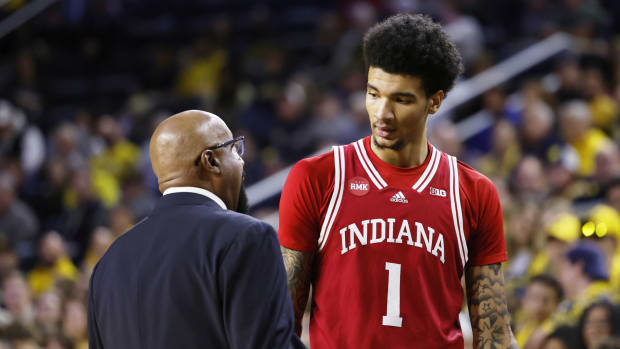 Indiana coach Mike Woodson talks to center Kel'el Ware (1) during the Hoosiers' matchup with Michigan.   