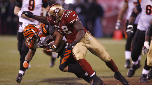 Dec 15, 2007; San Francisco, CA, USA; San Francisco 49ers linebacker Patrick Willis (52) delivers a hard hit against Cincinnati Bengals running back Kenny Watson (33) during the fourth quarter at Monster Park in San Francisco, CA. The San Francisco 49ers defeated the Cincinnati Bengals 20-13. Mandatory Credit: Cary Edmondson-USA TODAY Sports