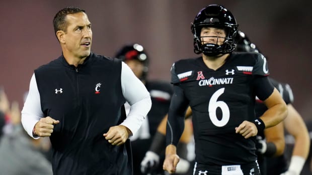 Cincinnati head coach Luke Fickell running out of the tunnel with the Bearcats.