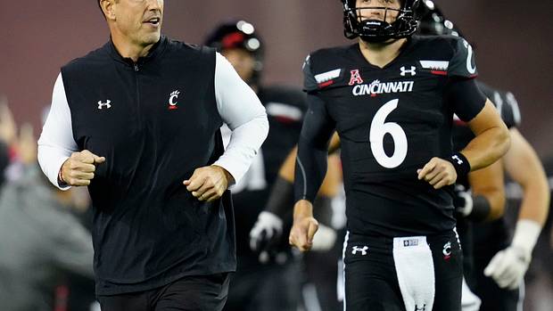 Cincinnati head coach Luke Fickell running out of the tunnel with the Bearcats.