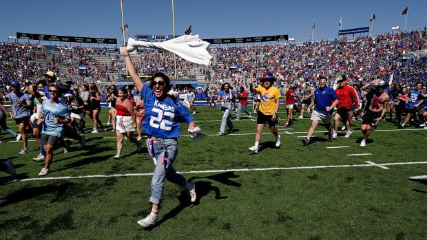 Kansas fans storm the field after the Jayhawks’ win over Duke.