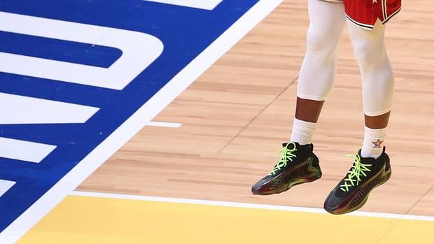 Anthony Edwards' black and green adidas sneakers worn in the 2024 NBA All-Star Game.