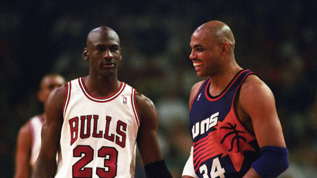 June 1993; Chicago Bulls guard Michael Jordan laughing with Phoenix Suns forward Charles Barkley