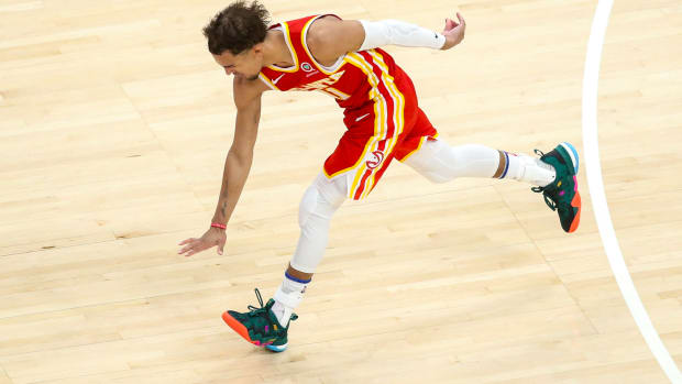 Atlanta Hawks guard Trae Young (11) celebrates a basket against the New York Knicks in the fourth quarter during game three in the first round of the 2021 NBA Playoffs at State Farm Arena.